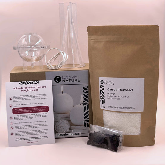 Kit complet pour fabriquer des bougies moulées avec cire de tournesol, mèches en coton brut, colorant solide noir et moules transparents.
